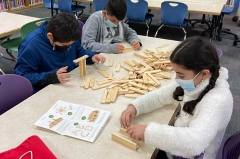 Image of students playing with the library makerspace Brain Blox!