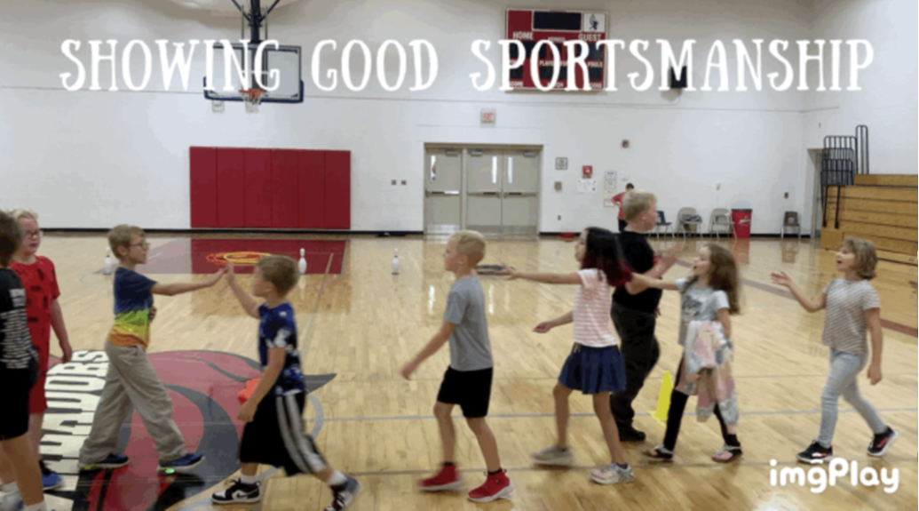 Showing good SPORTSMANSHIP - Students high fiving 