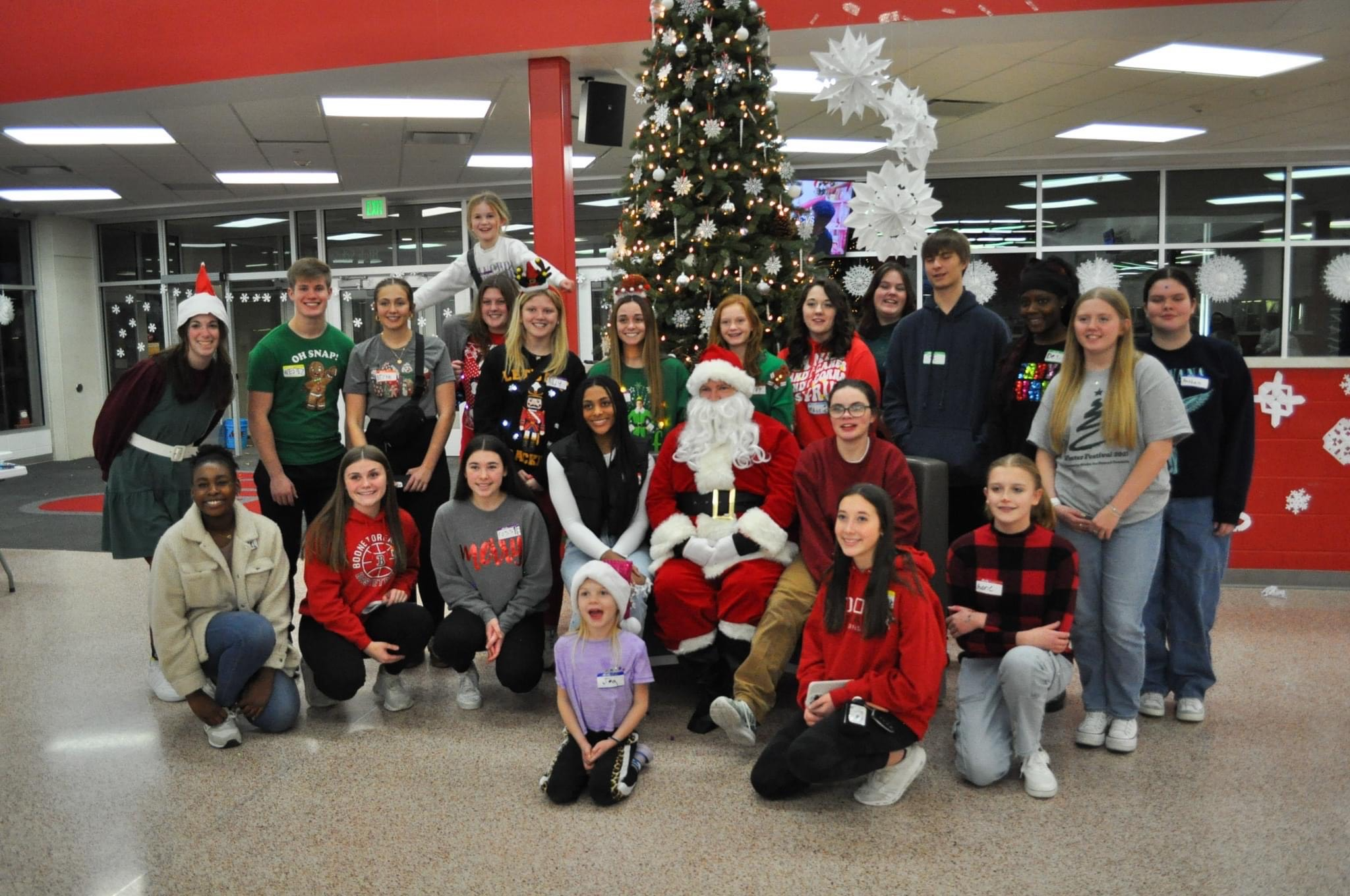 FCCLA students group photo in front of christmas tree