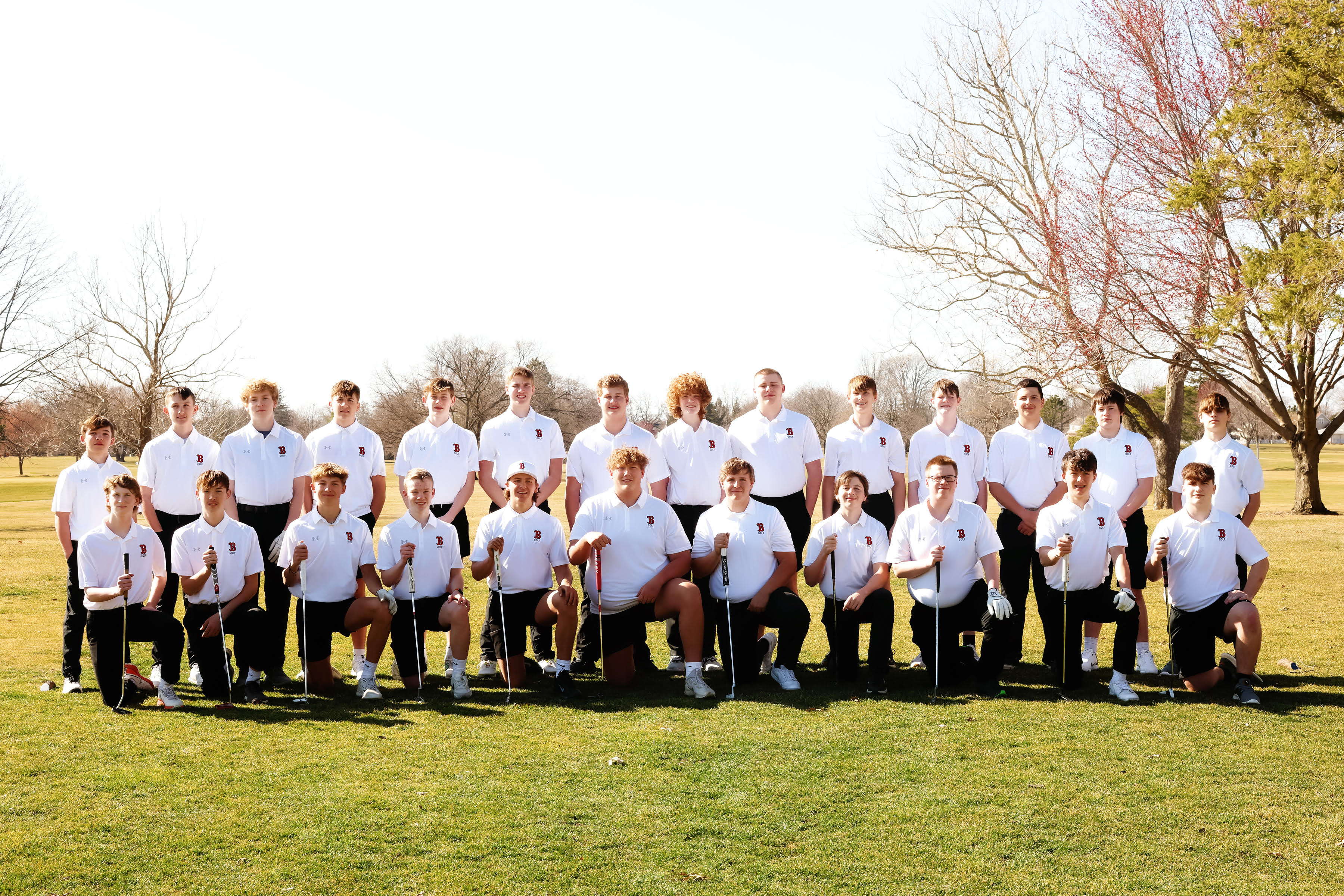 Boys Golf players on the grass