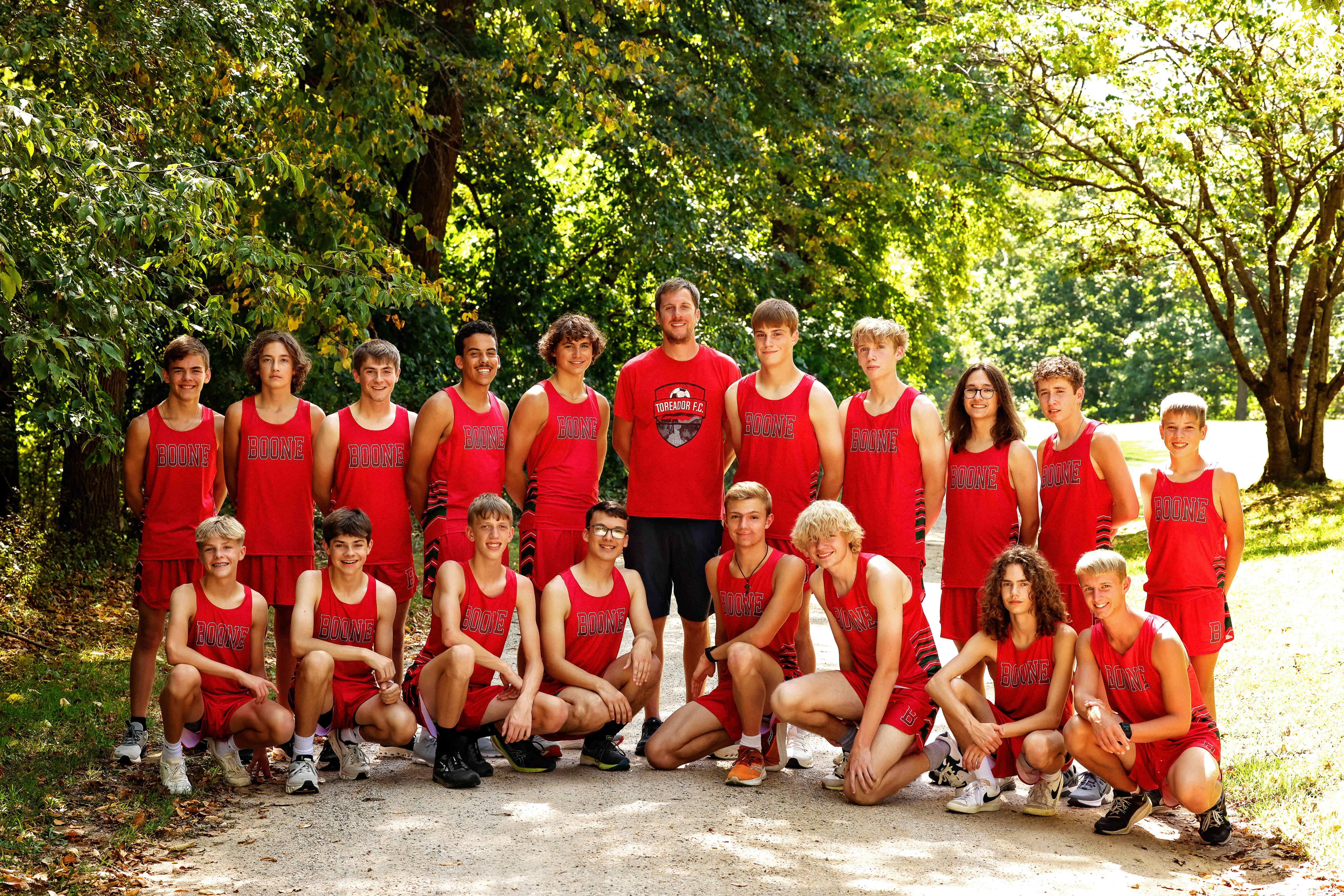 Boys Cross Country picture outside by trees