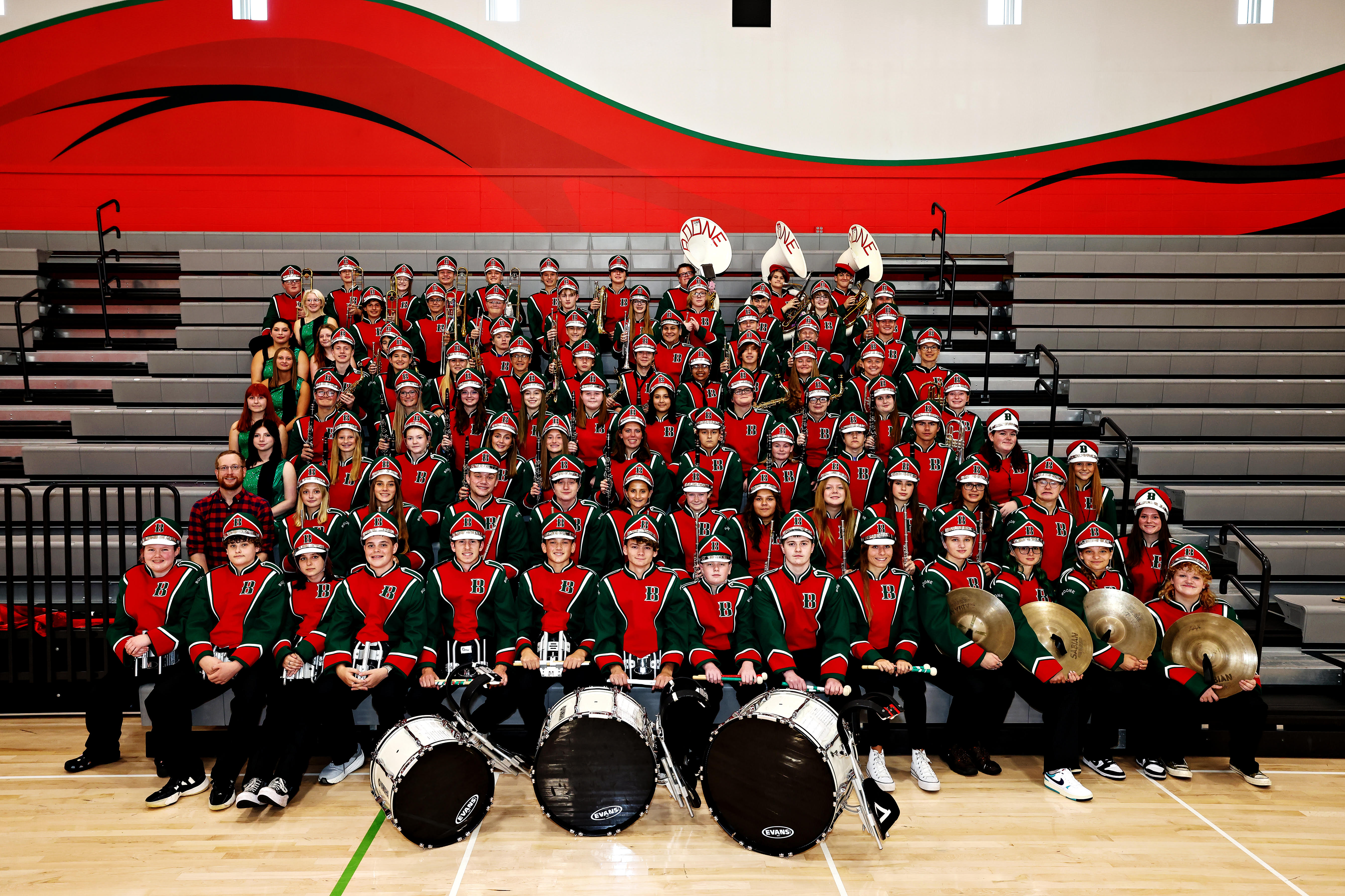 Marching Band students on bleachers at football field