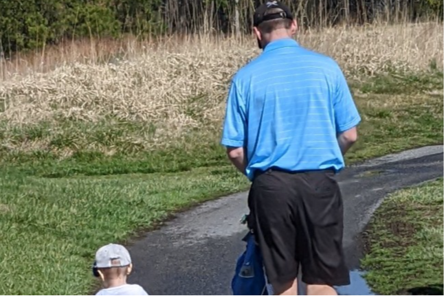 The guys (Daddy & boy #1) walking the golf course.