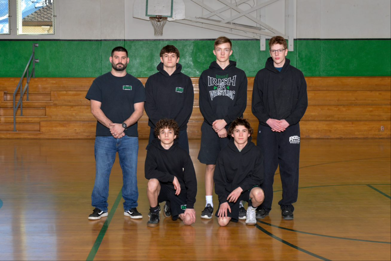 Wrestling coaches with Riddle wrestlers