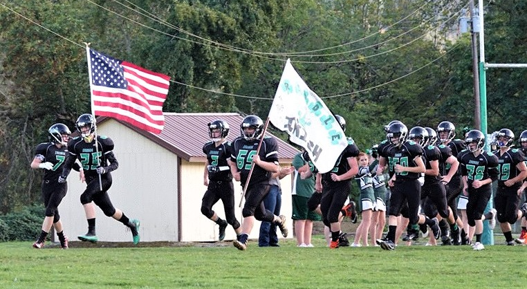 RHS football players coming on to the field.