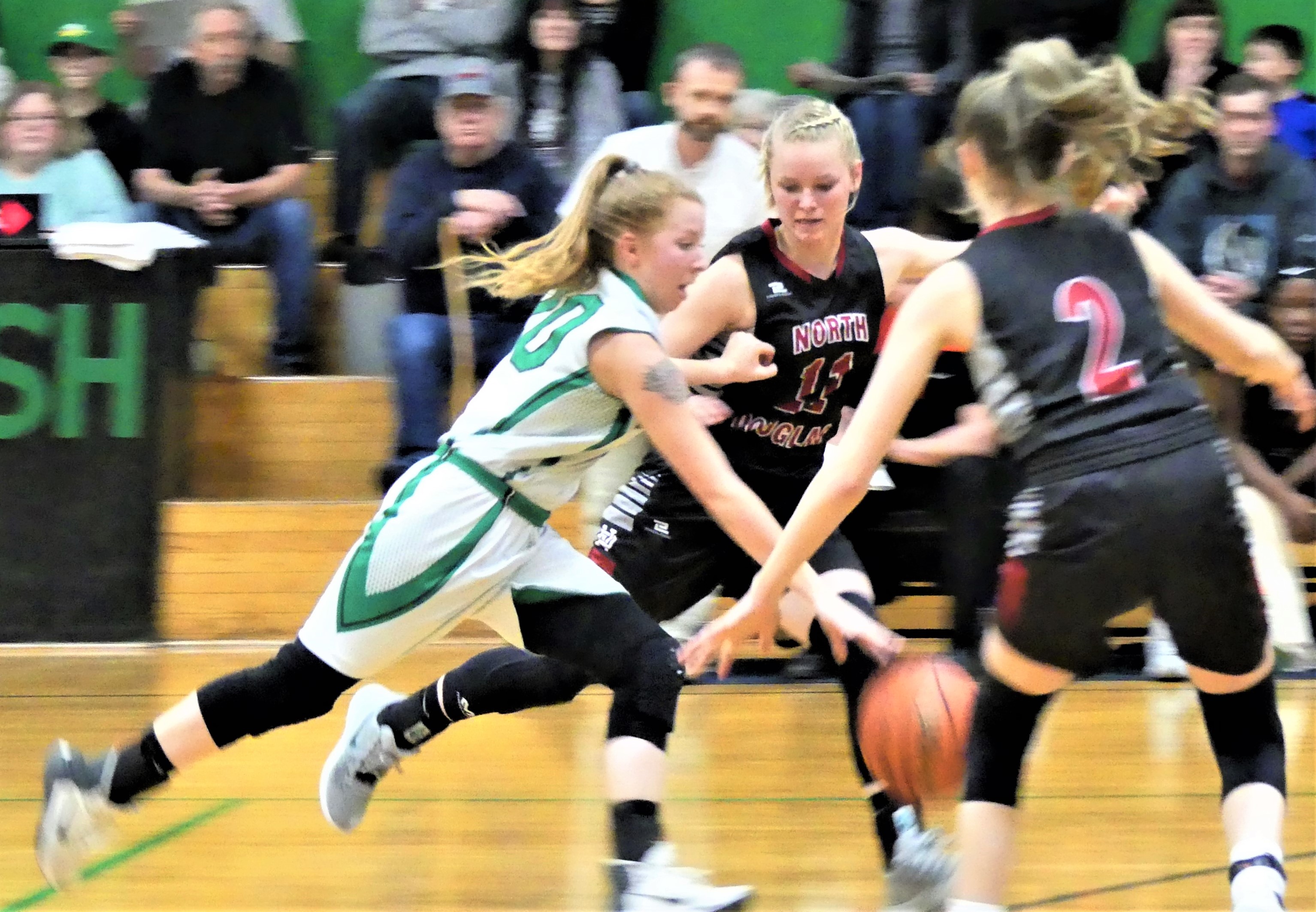 Player dribbles the ball down the court.