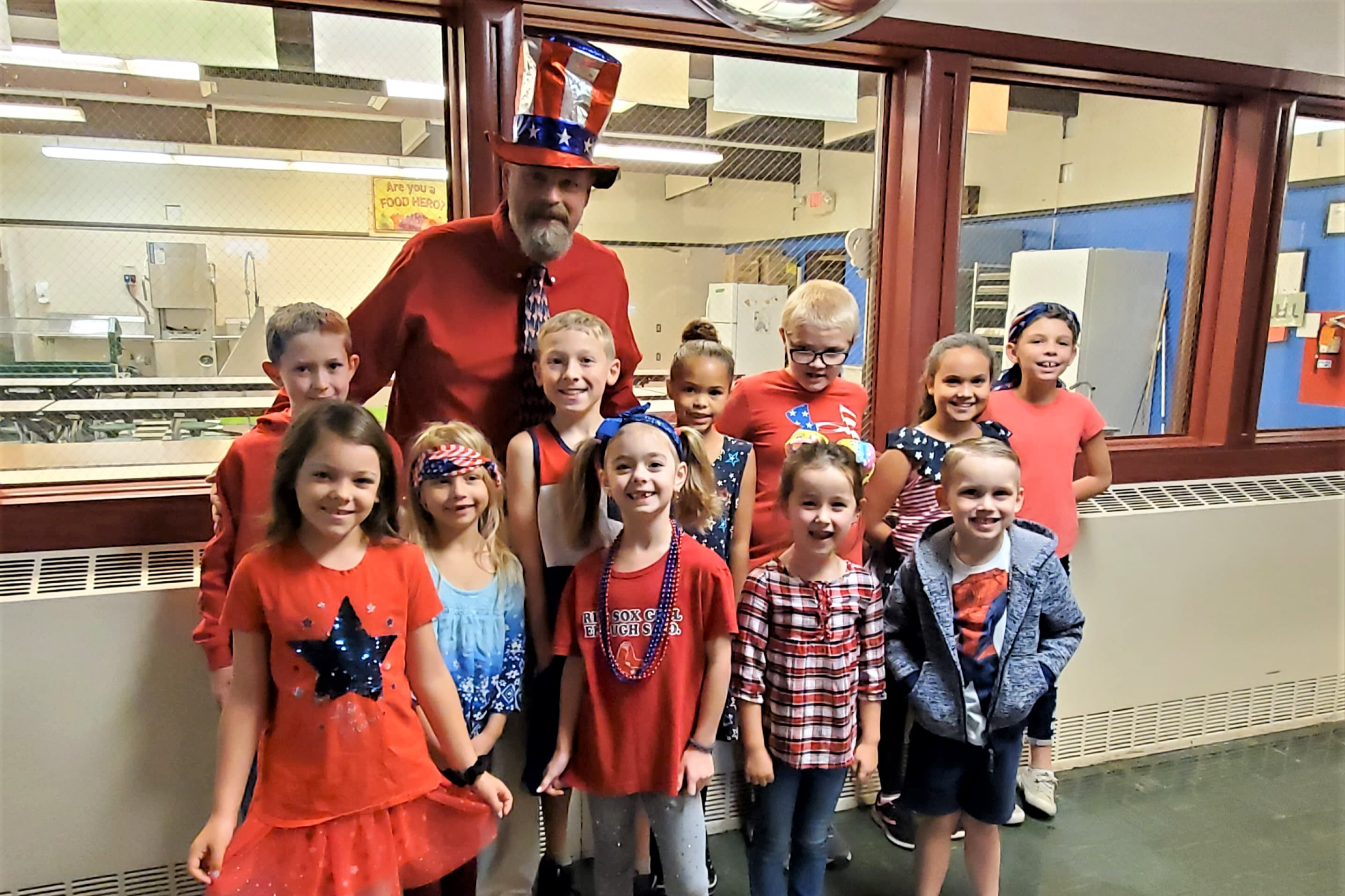 Mr. Gianotti with students celebrating patriotism.