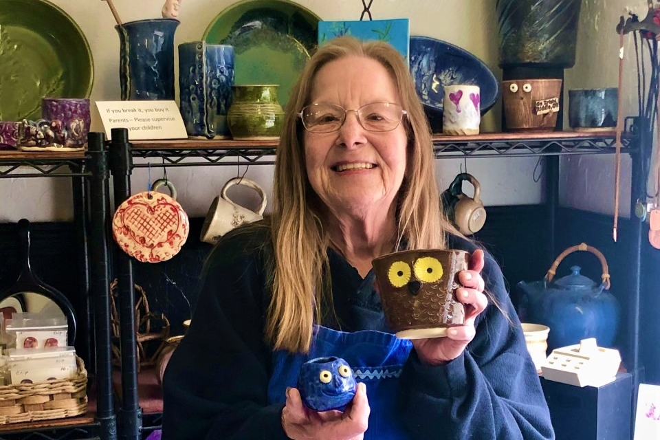 Carol Ratliff, guest pottery teacher at Riddle Jr./Sr. High School displays some pottery in her shop.