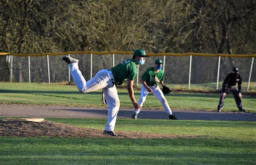 Riddle baseball game against Oakland. Riddle pitcher throws from the mound.