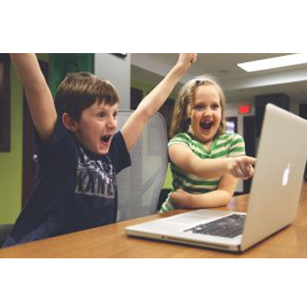 Children cheering at a laptop