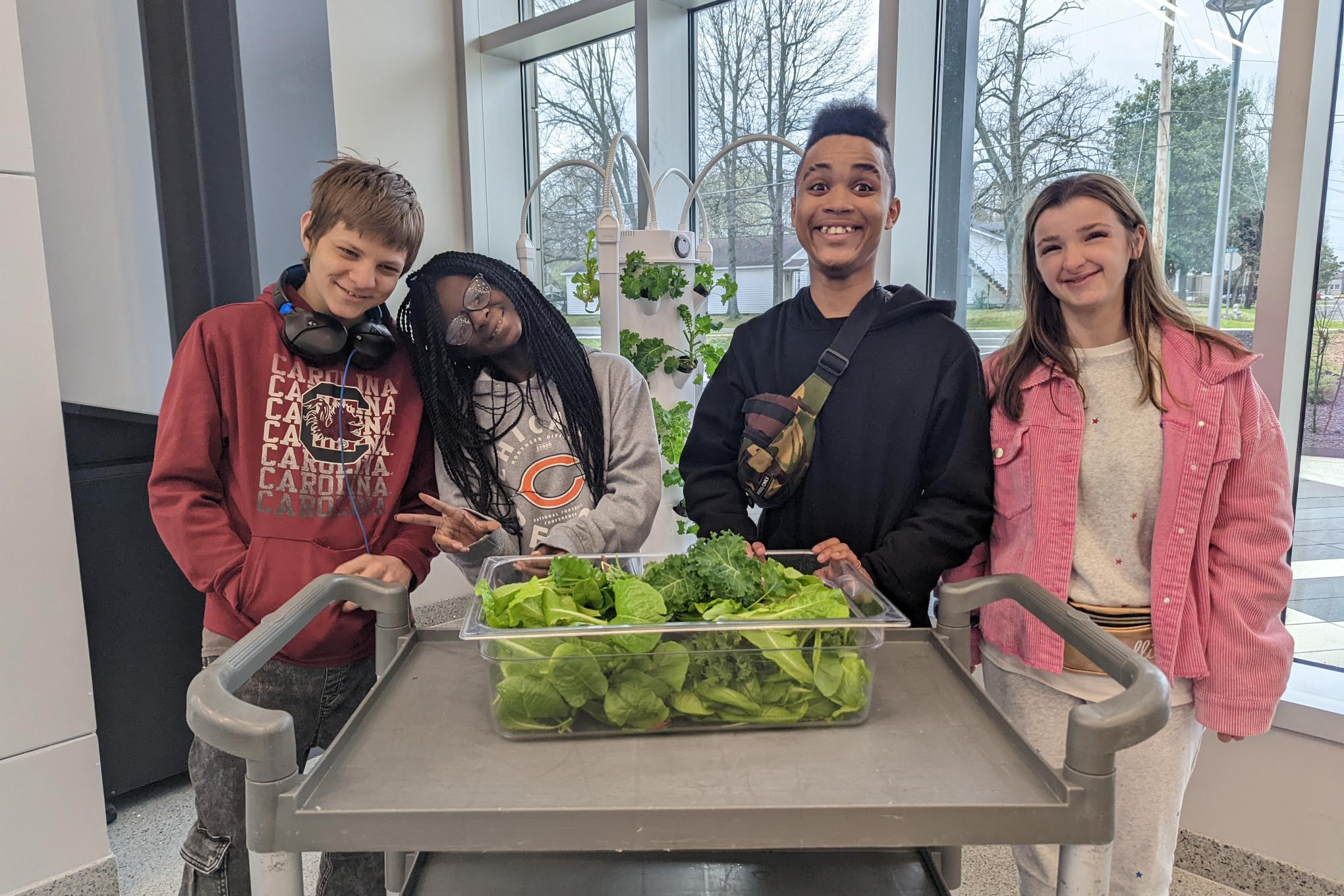 Image of students with tower garden harvest