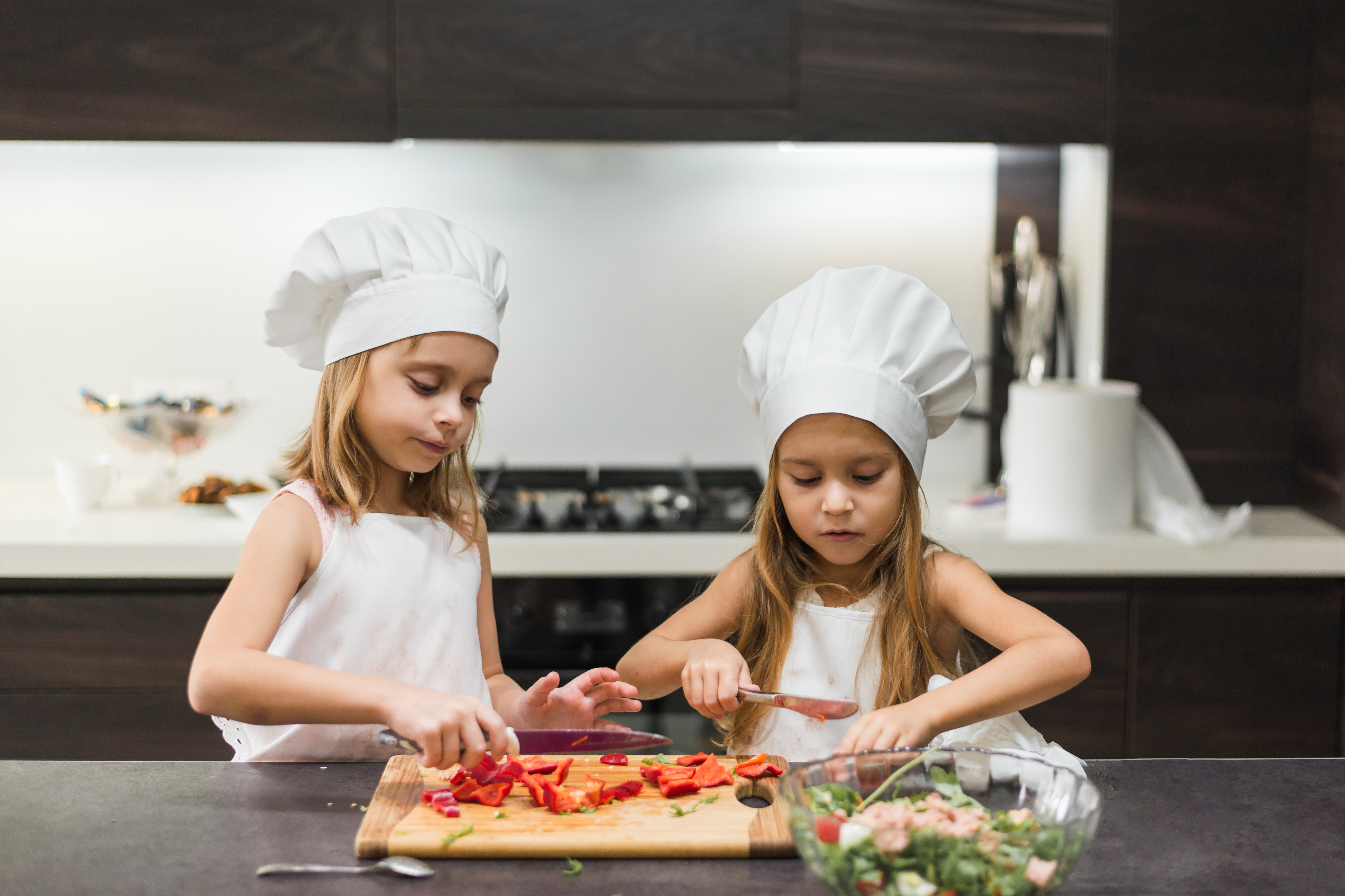 Image by <a href="https://www.freepik.com/free-photo/cute-little-sisters-cutting-bell-pepper-cutting-board-while-preparing-food_3775917.htm#query=children%20cooking&position=14&from_view=keyword&track=ais_hybrid&uuid=c8e9ee60-ab70-40b8-807b-80104f77e4fc">Freepik</a>