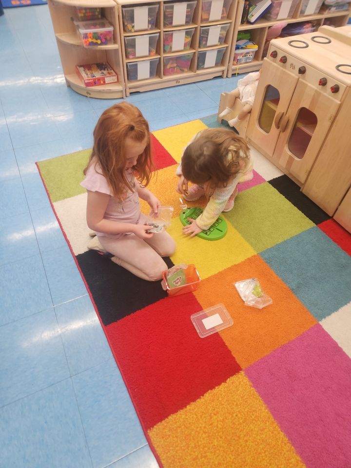 Pre-K students explore their learning centers.