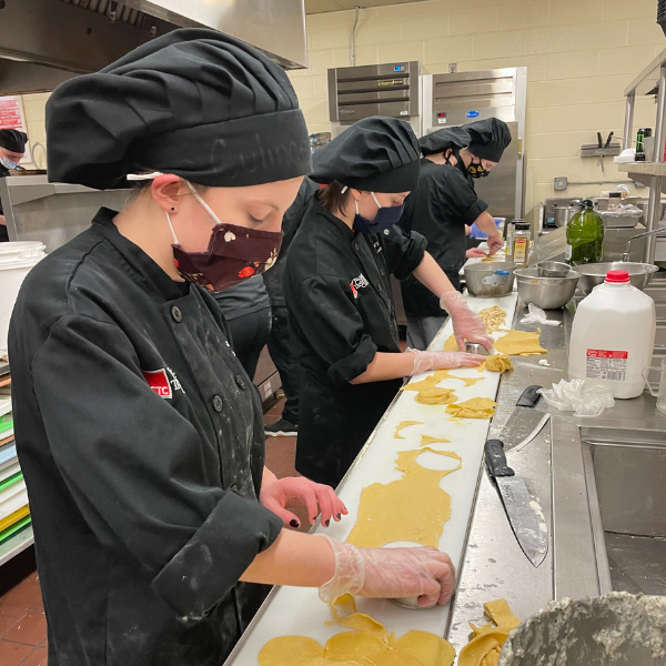 Students preparing pasta