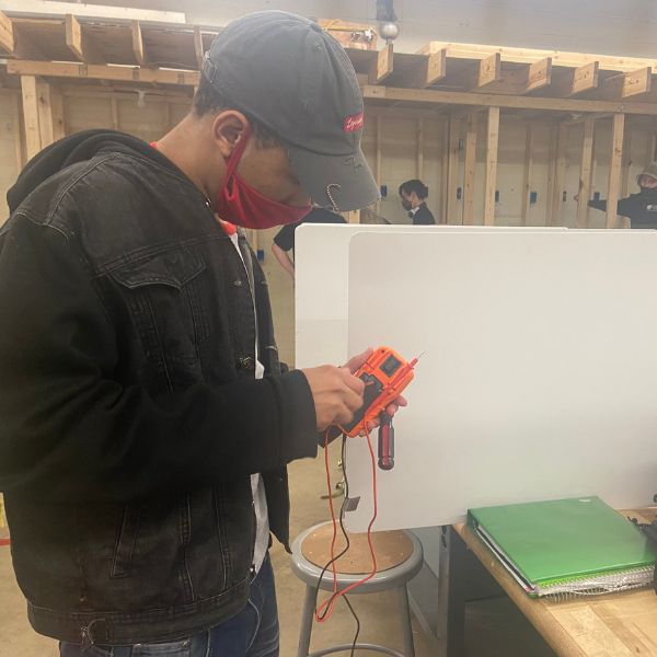 Student working on electrical assignment