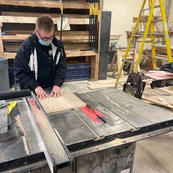 Student making a cutting board