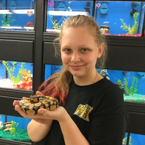 Student holding a snake