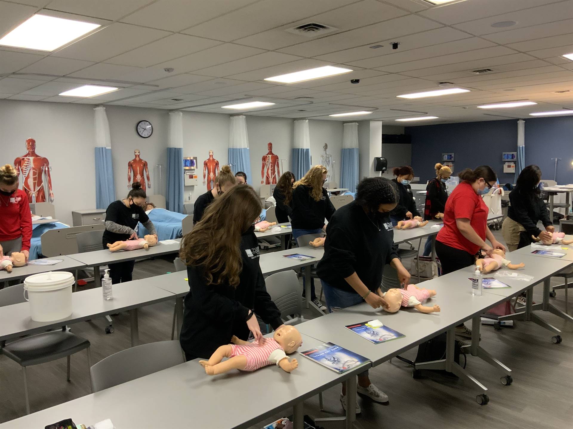 Student learning infant CPR