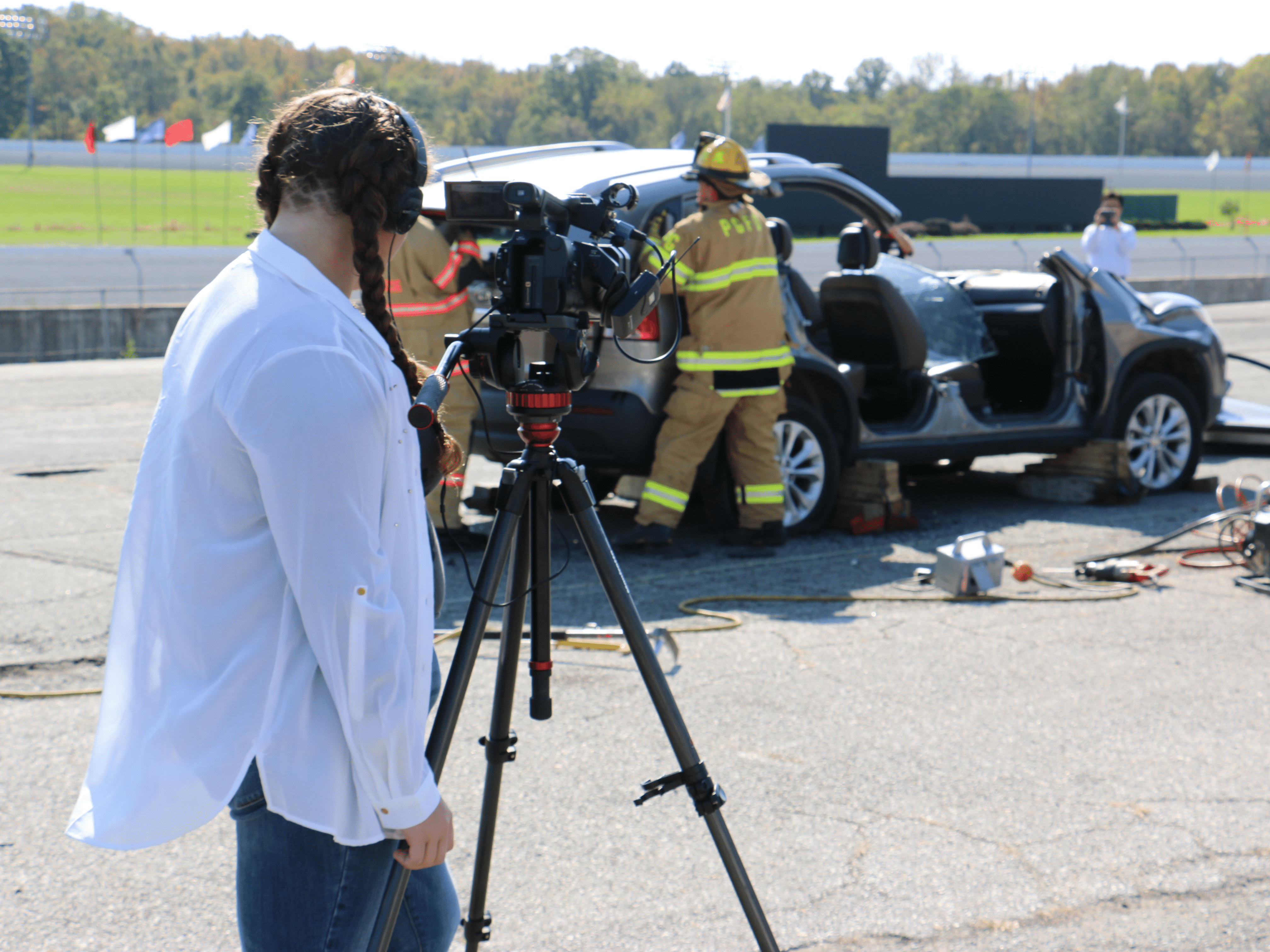 Students filming a fire scene
