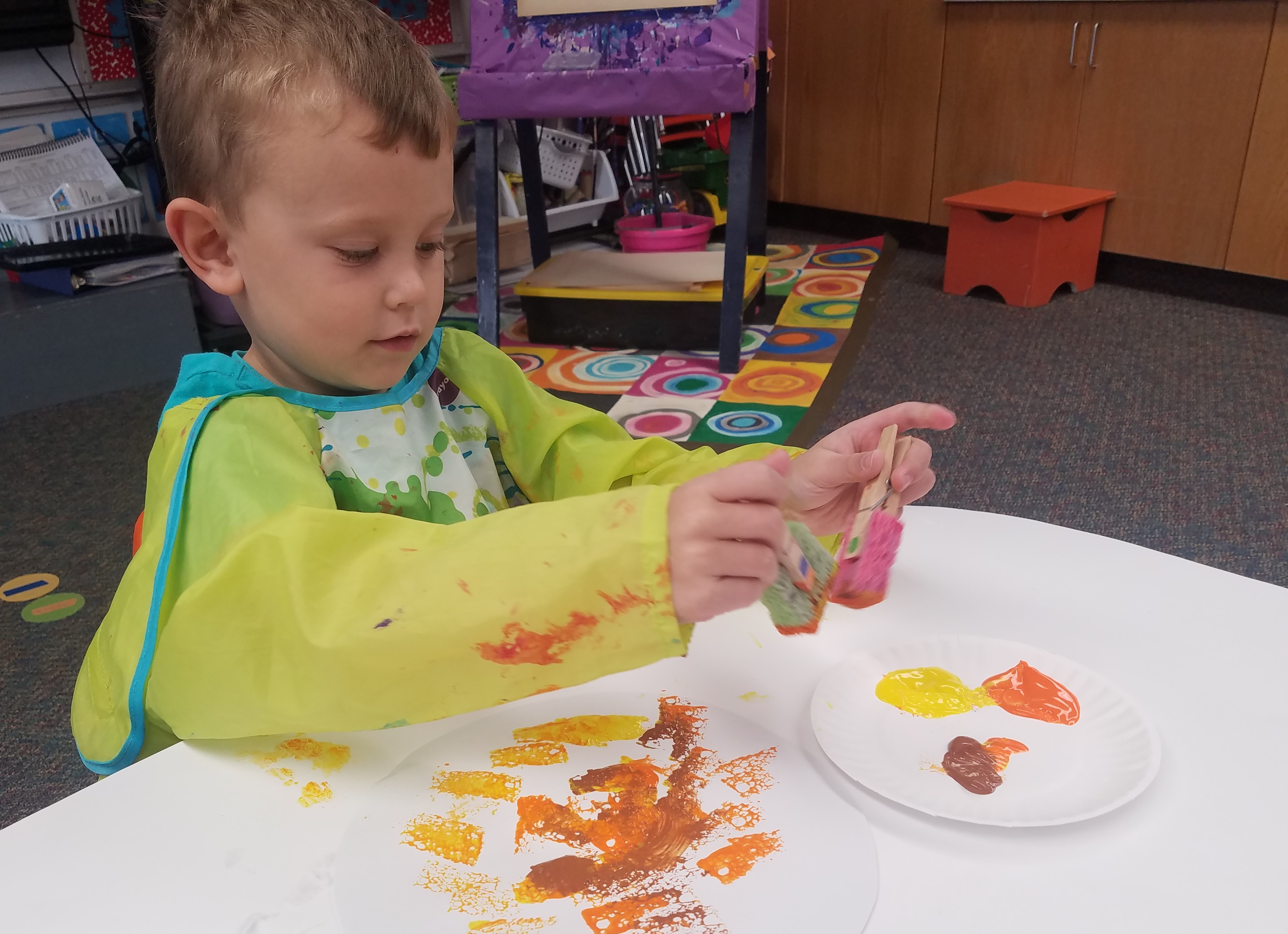 In art, the process is more important than the product. As children use art materials, they are planning and carrying out a task. They also use symbols to represent their ideas.