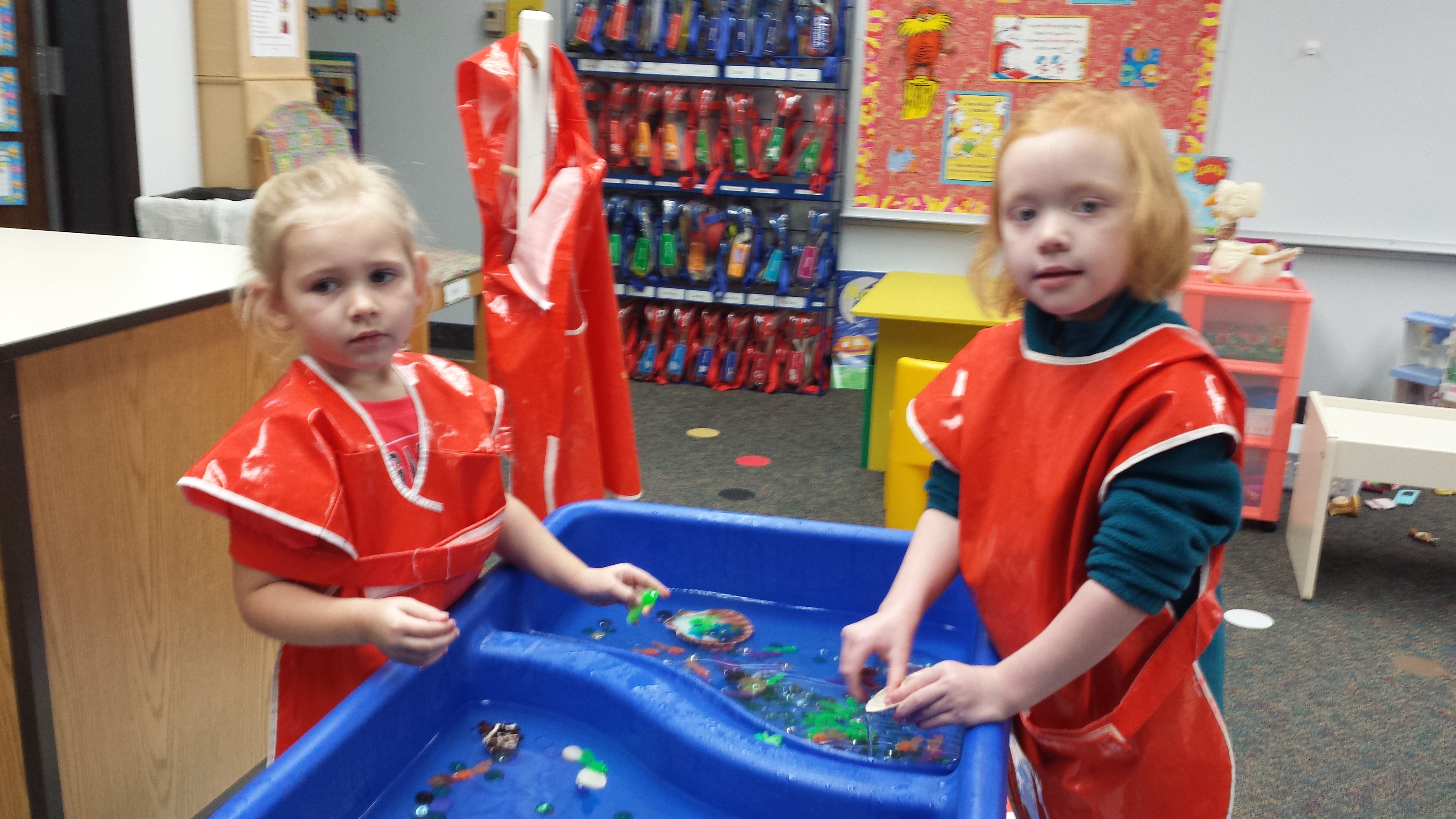 Our sensory table is a popular spot in the preschool classroom. Sensory materials include water, bubbles, sand, rice, snow, and ice, along with scoops, cups, funnels, brushes, dinosaurs, blocks, pebbles, seashells, etc. 