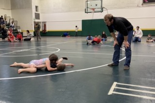 students wrestling together