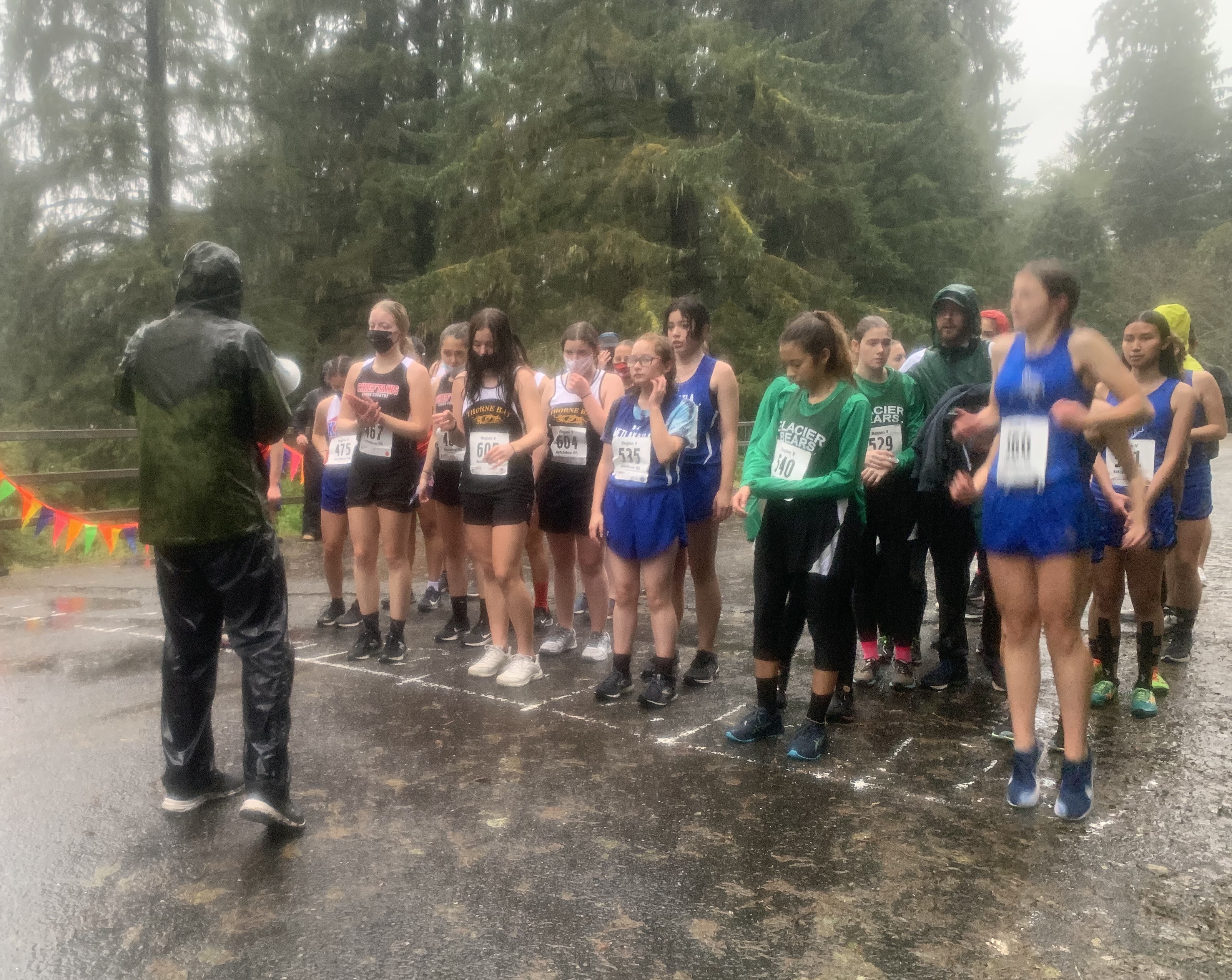 cross-country members preparing to run in the rain