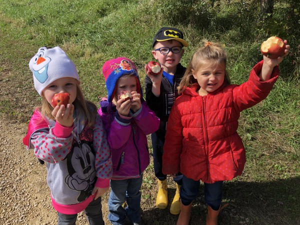 Children holding apples