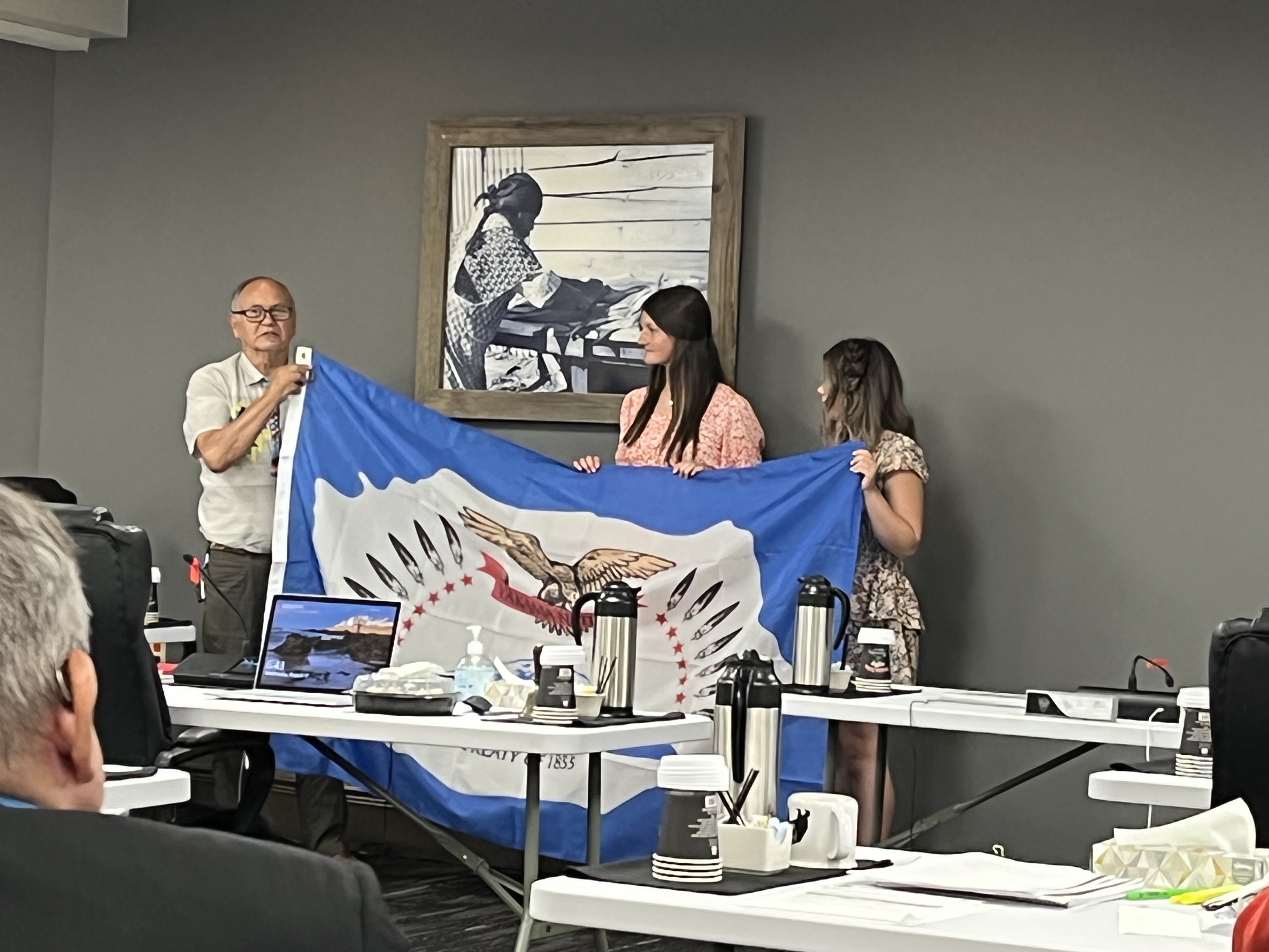 Yakama Nation Tribal Council Chairman Saluskin presenting students with a Yakama Nation flag 