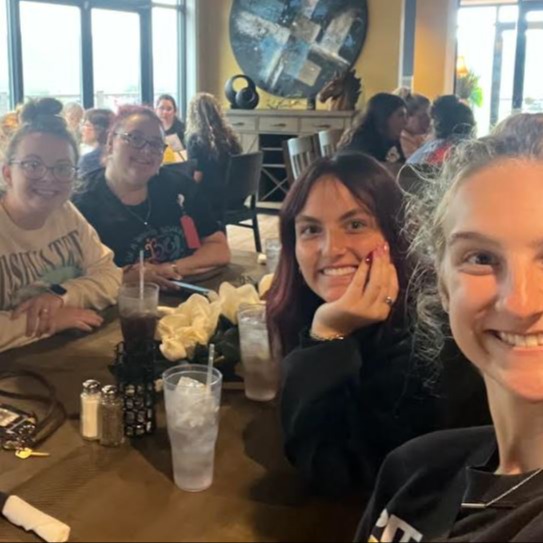 WSIS staff enjoying lunch together during a team-building gathering.