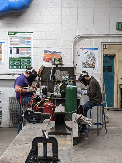 High School boys in welding shop