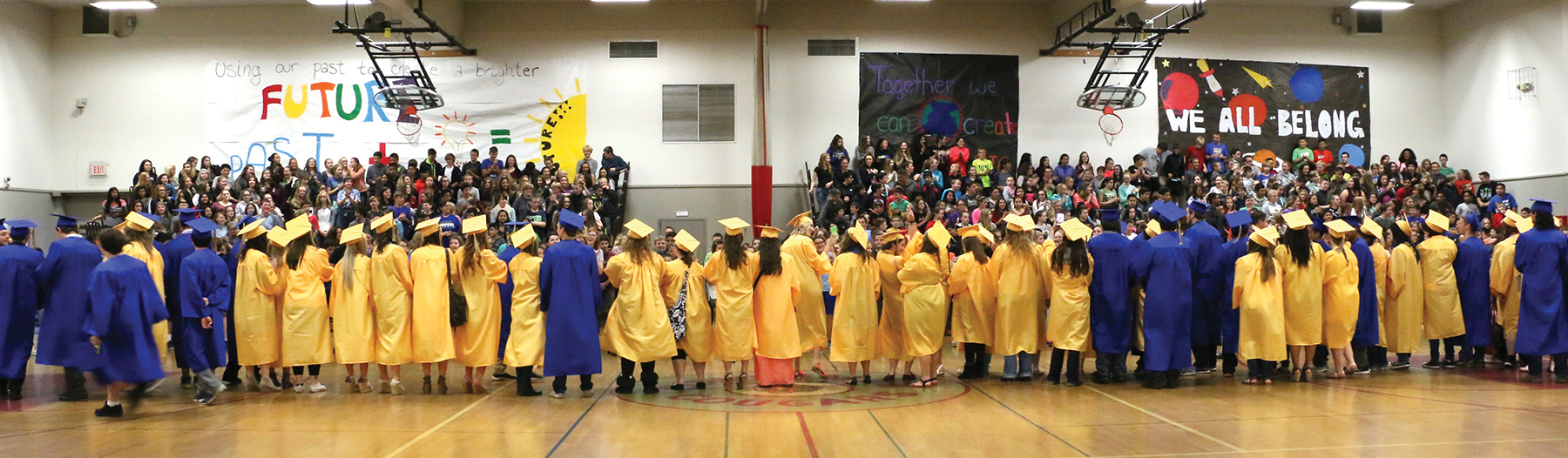 Graduates lined up in front of audience