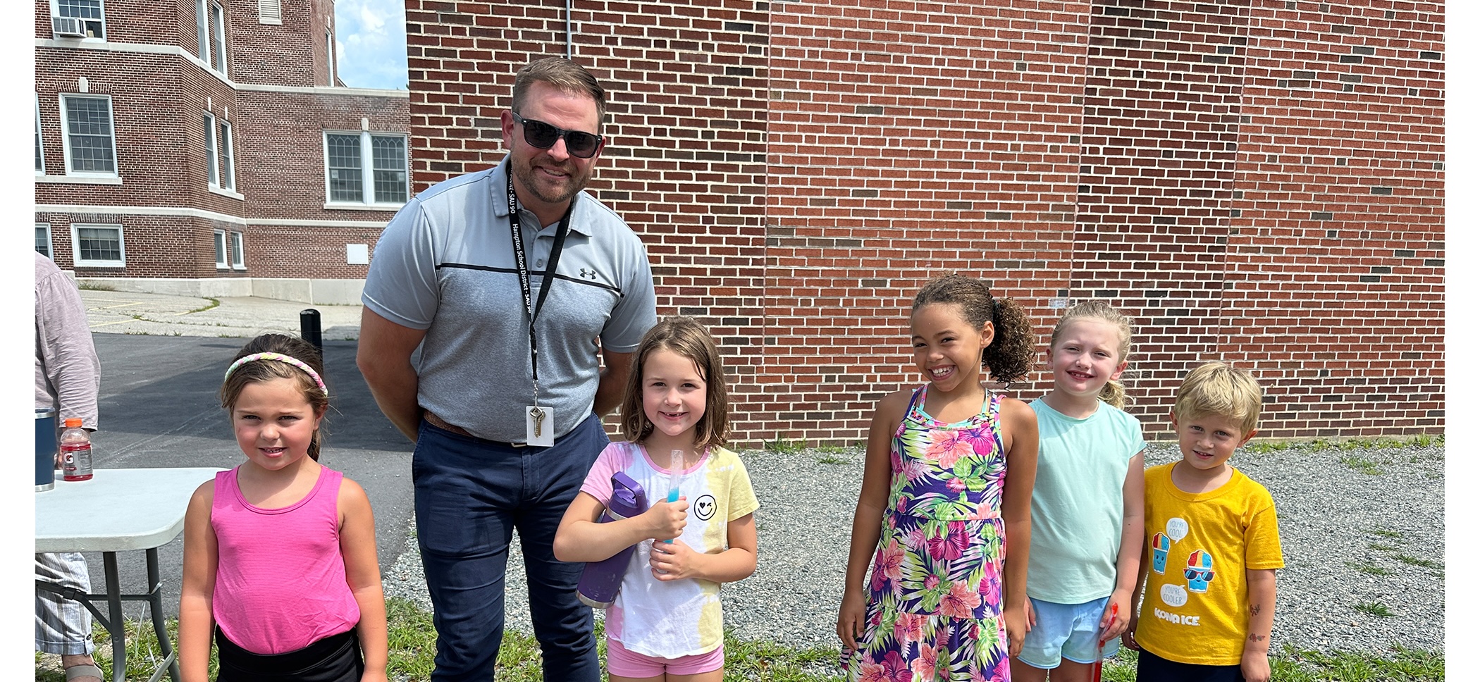 Principal standing with students