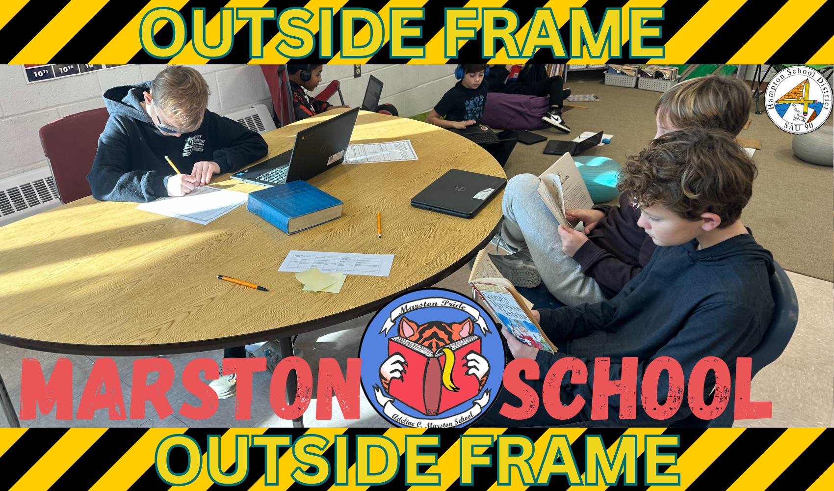 students in classroom reading books