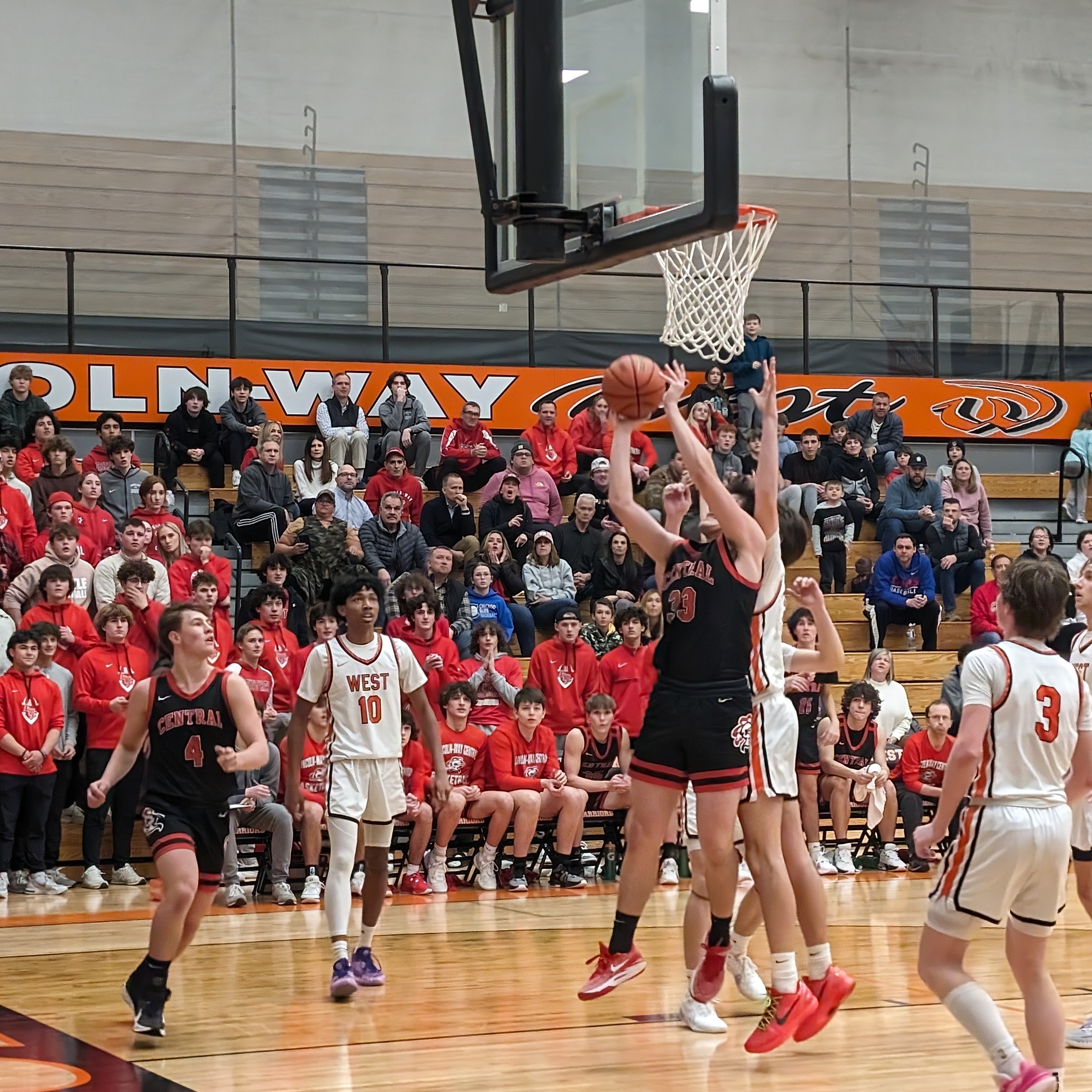 Basketball athlete taking a shot on the court