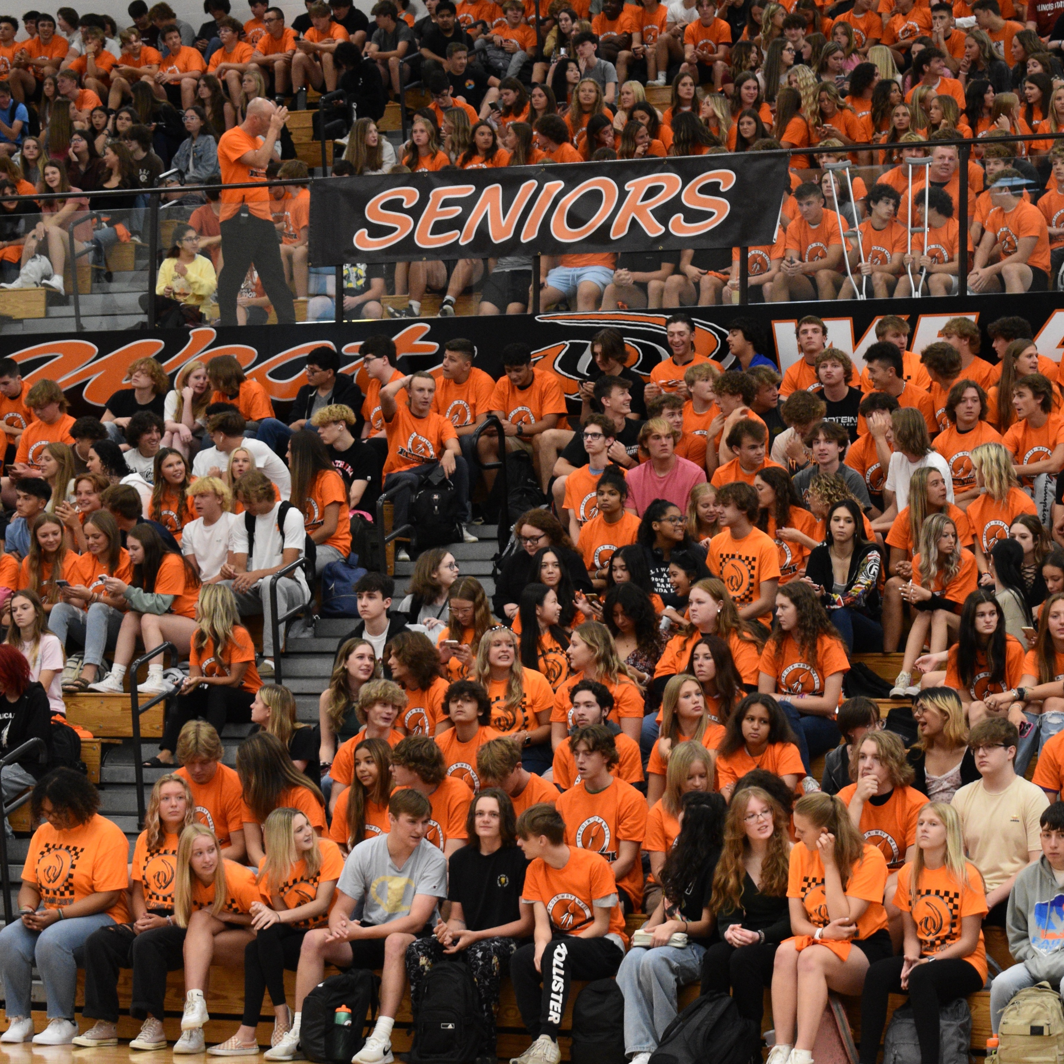 Seniors seated in the bleachers