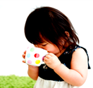 A toddler drinking from a cup
