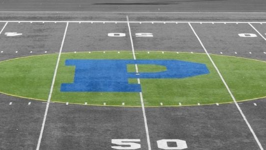 Black and white picture of football field with Plainwell "P" highlighted in green and blue.