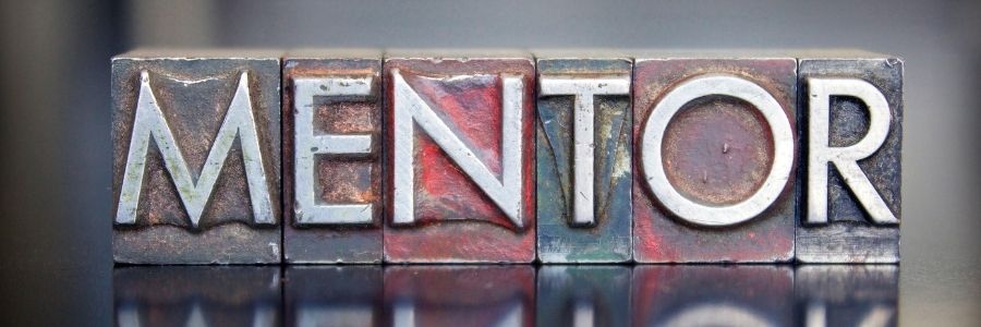 Metal letters spelling out the word Mentor