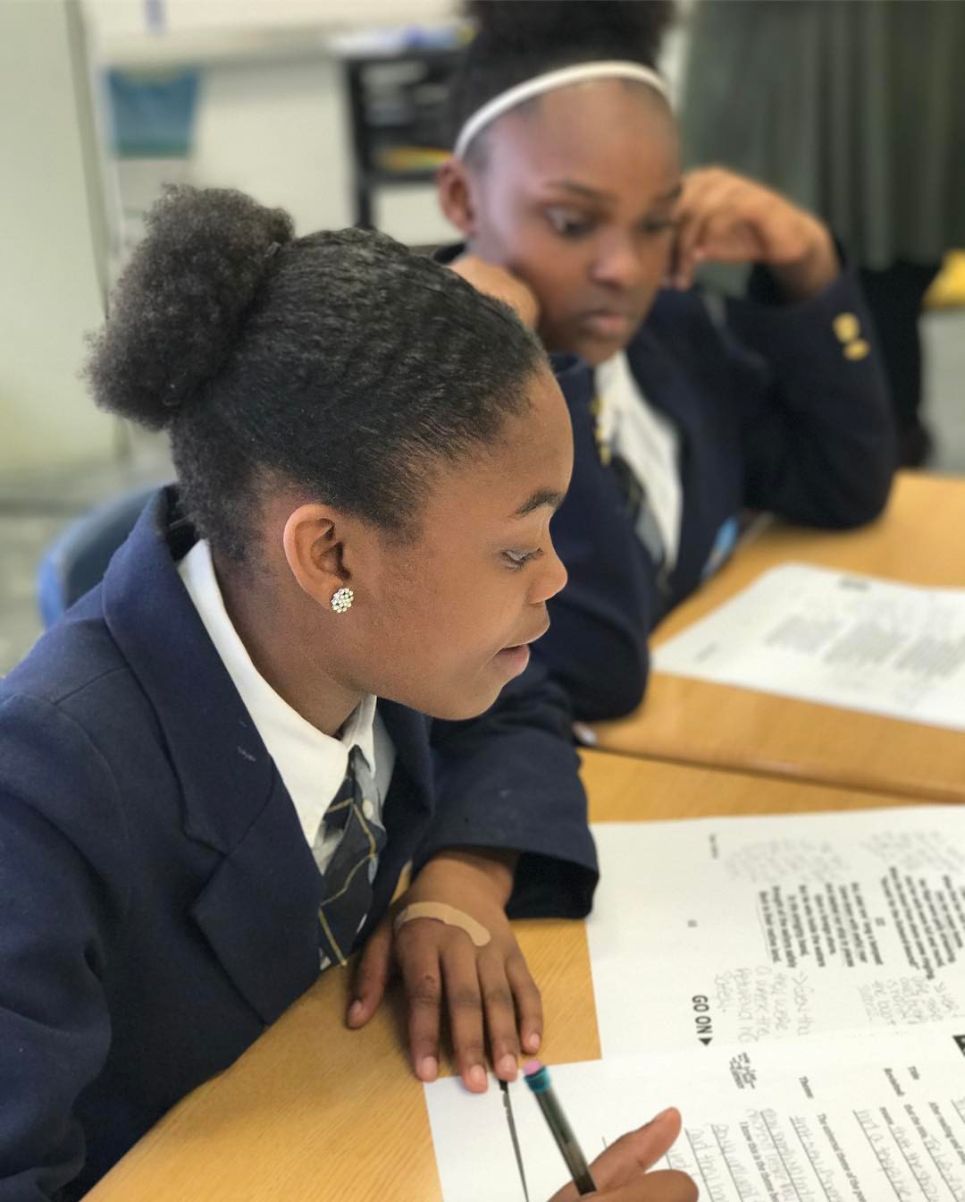 Students work hard on an assignment at their desk