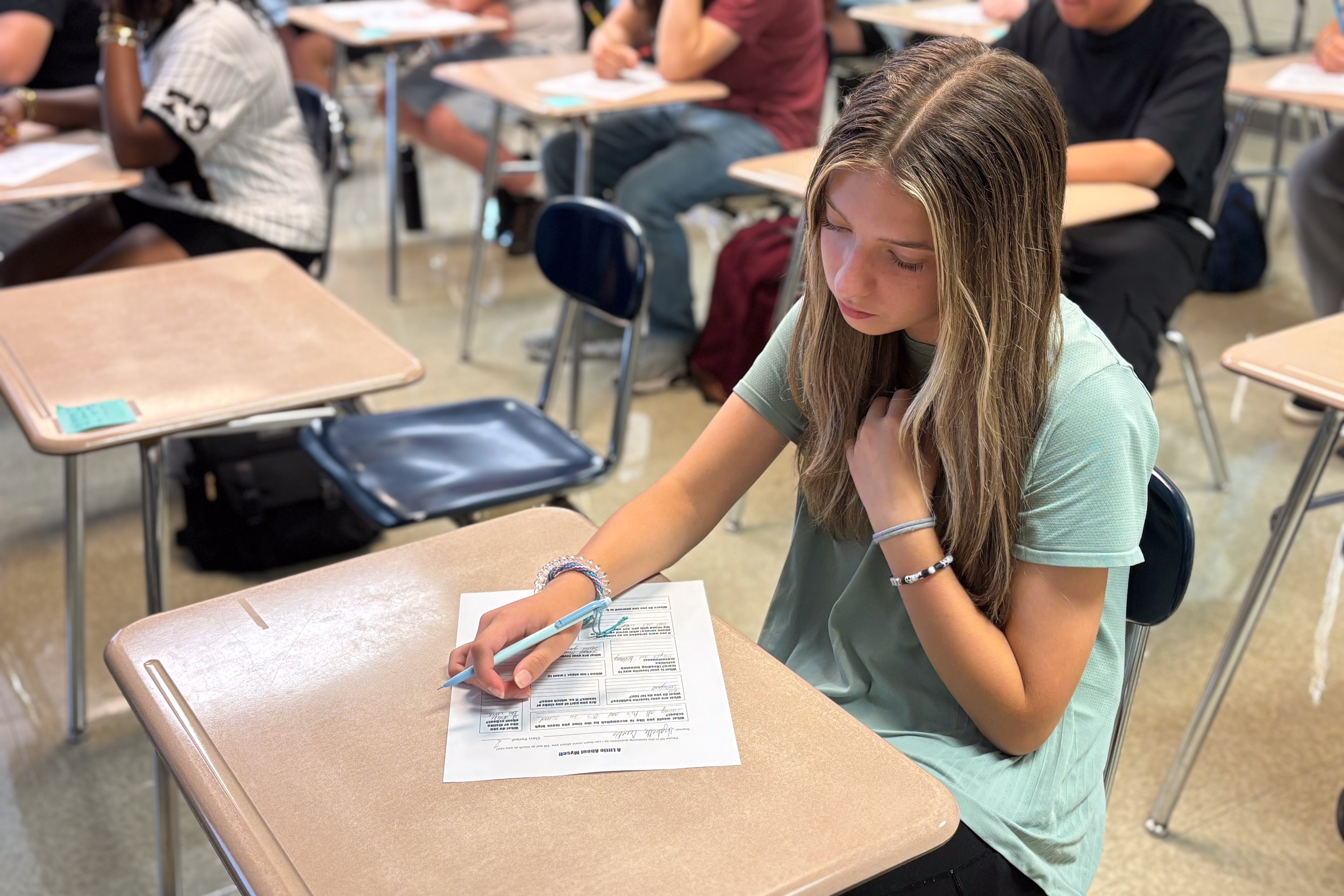 High School student working in classroom