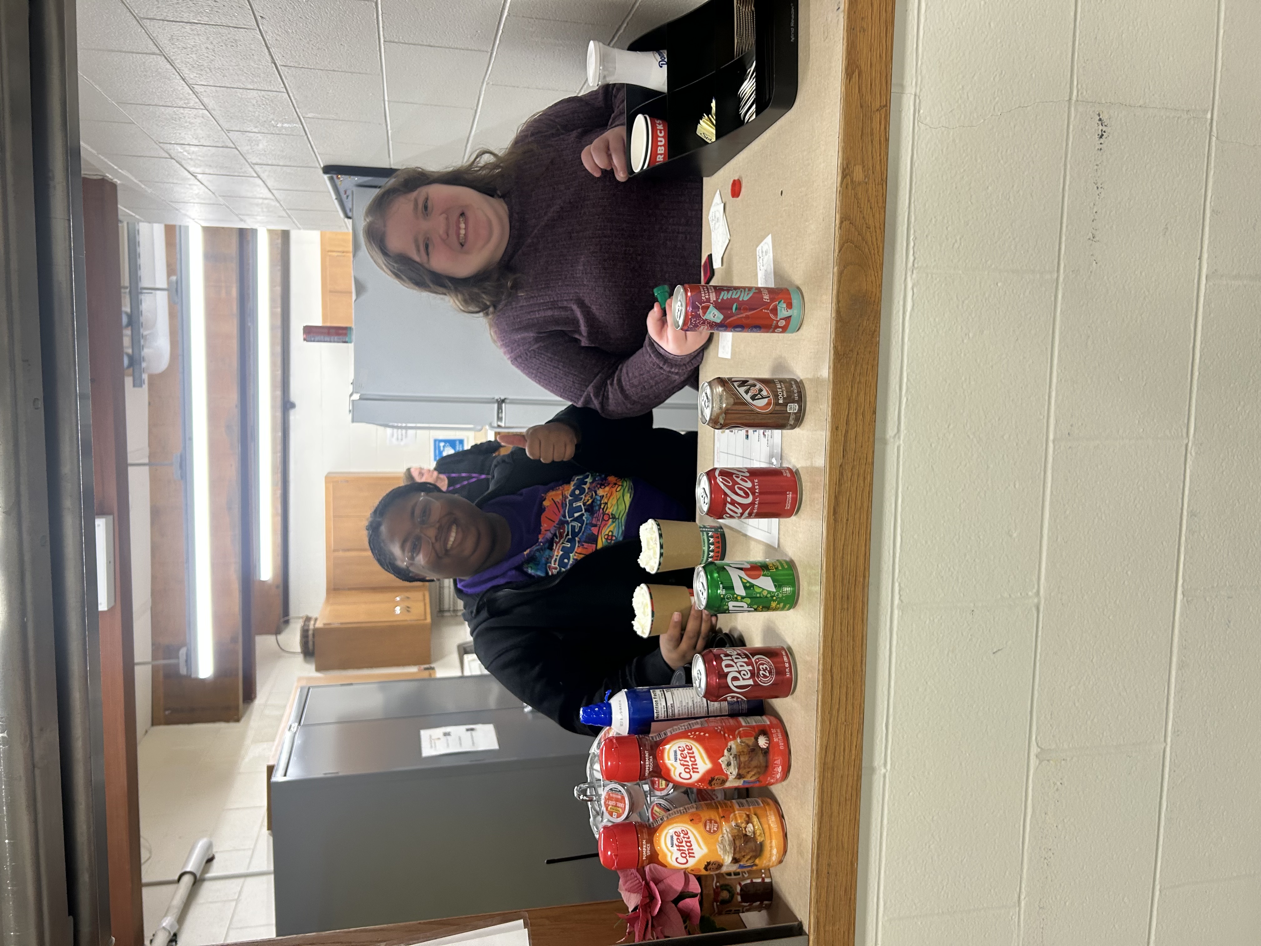 Student and parapro running coffee shop