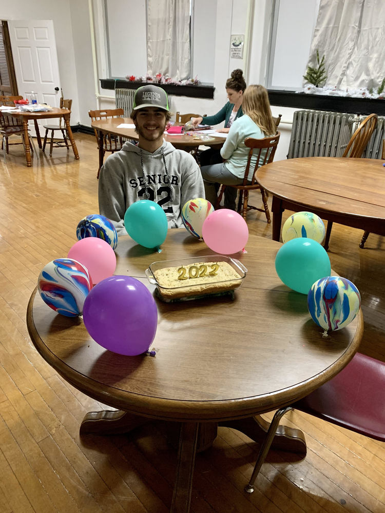 Student with cake