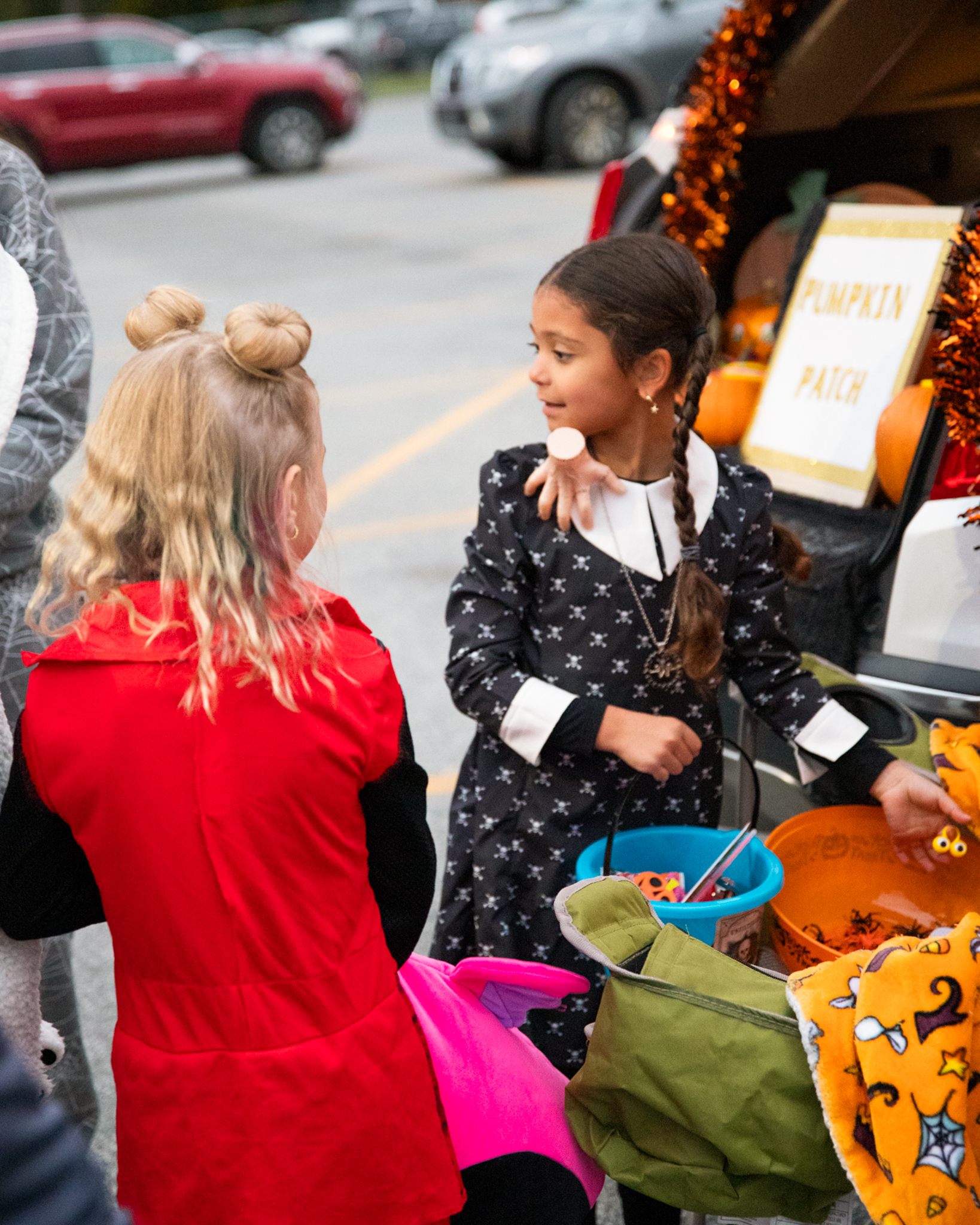 Little girl dressed as Wednesday Adams
