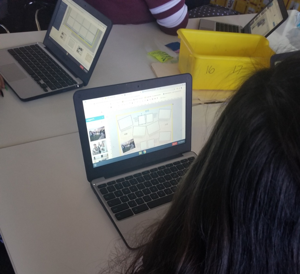 Student editing the yearbook on a laptop