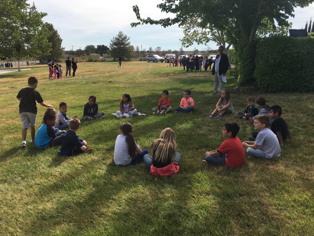 Students playing Duck Duck Goose