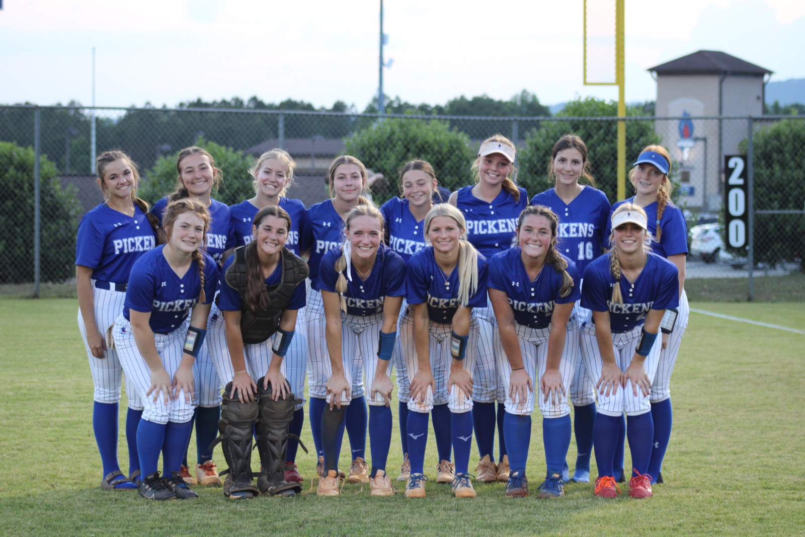 PICKENS softball team poses together after beating Wren in second round of south carolina state playoffs