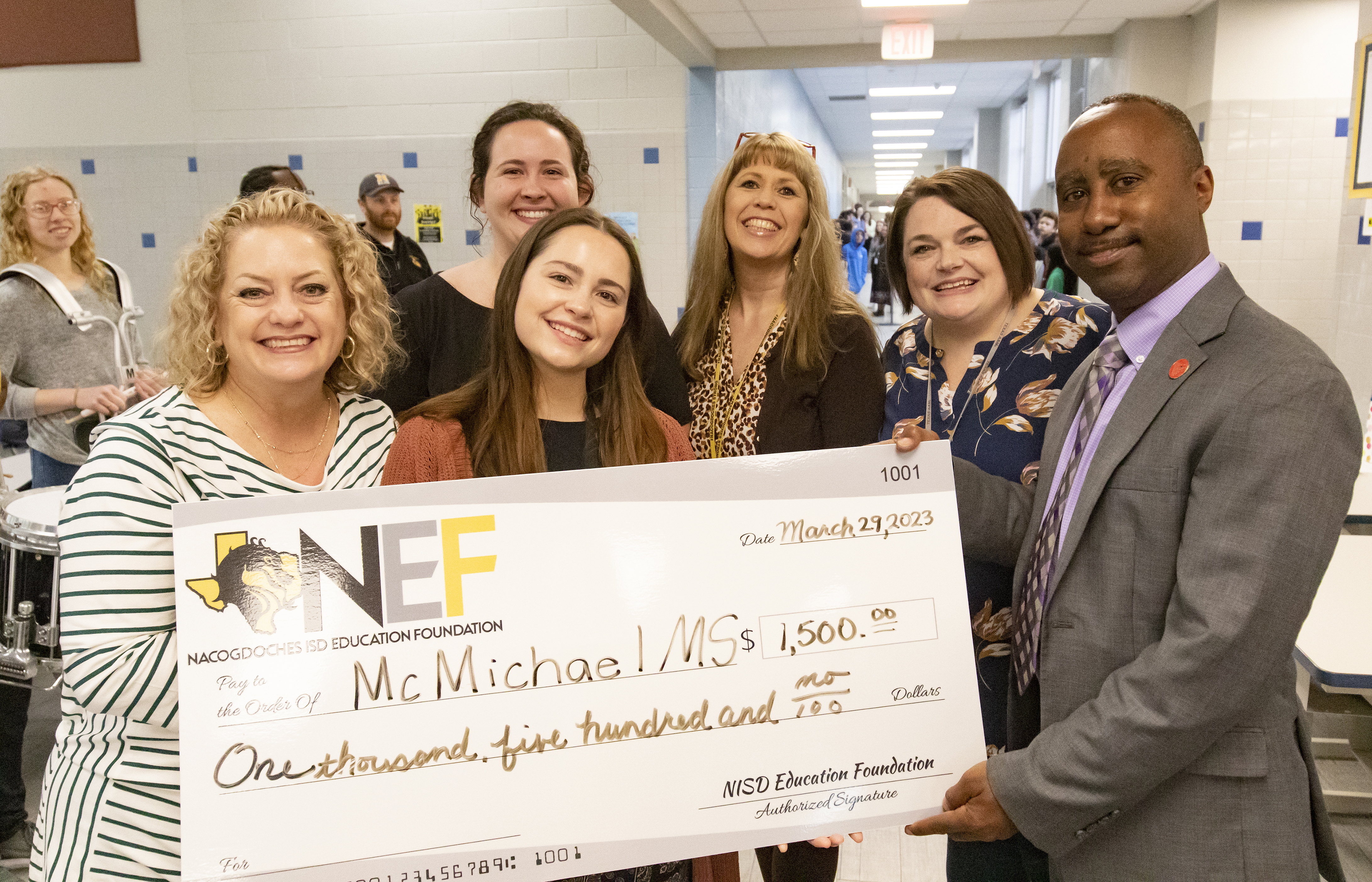 McMichael Middle School teachers (from left) Annemarie Story, Suzanna Sanchez, Emily McKenzie, Crystal Kilmer and Reagan Fitch Reyna shown with Nacogdoches ISD Education Foundation president Terrance Reeves.