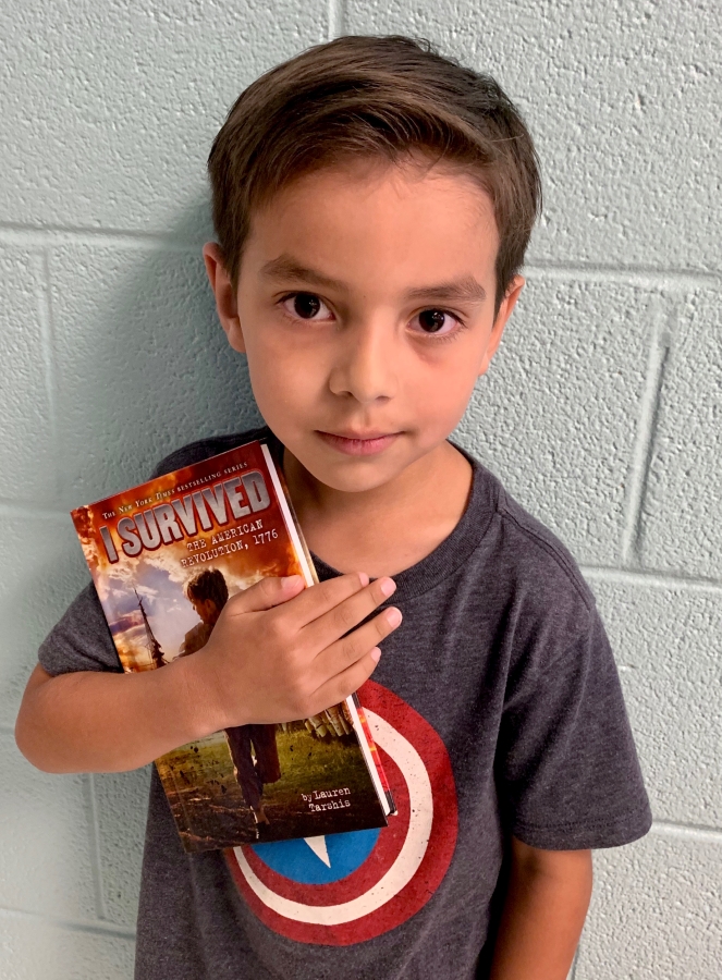 Student holding a book