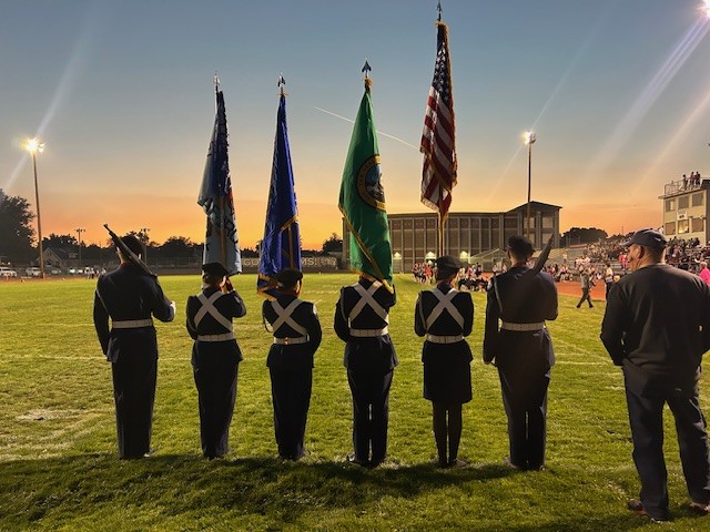 JROTC students holding flags